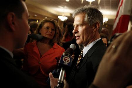 Republican Scott Brown talks to the media after announcing his bid for the United States Senate primary election in Portsmouth, New Hampshire, April 10, 2014. REUTERS/Dominick Reuter