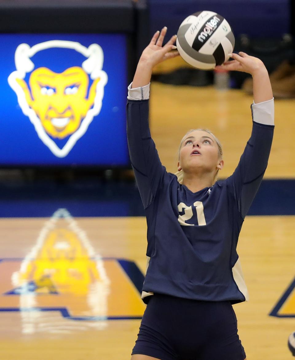 Hoban junior Sophia Day sets the ball for a teammate during a Division II district semifinal against CVCA on Oct. 26, 2022, in Tallmadge.