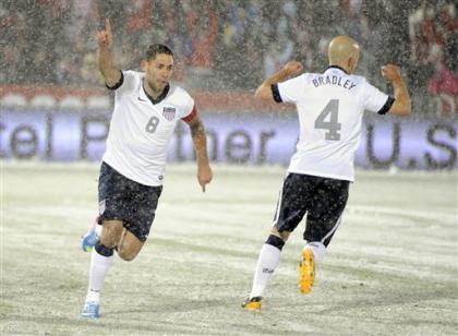 Clint Dempsey (8) celebrates his winning goal with Michael Bradley (4) against Costa Rica. (AP)