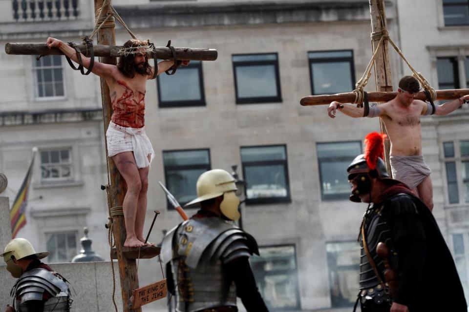 Jesus hangs from the cross in the performance of The Passion of Jesus in Trafalgar Square (Reuters)