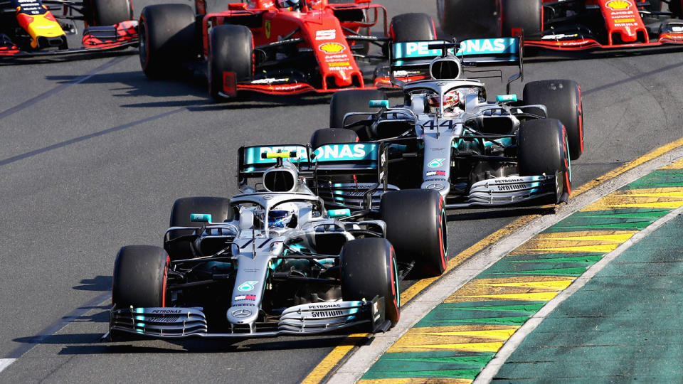 Valtteri Bottas (front) passed Lewis Hamilton for the lead into the first lap. Pic: Getty