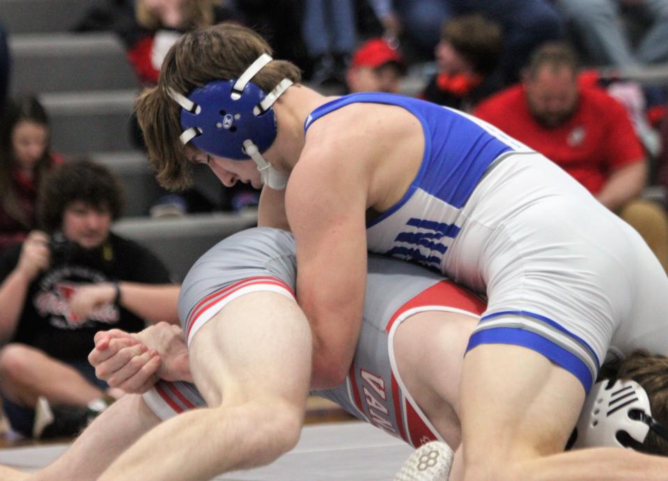 Auburn's Dresden Grimm wrestles against Vandalia's Owen Miller in the Class 1A Auburn Regional final at 138 pounds on Saturday, Feb. 4, 2023.