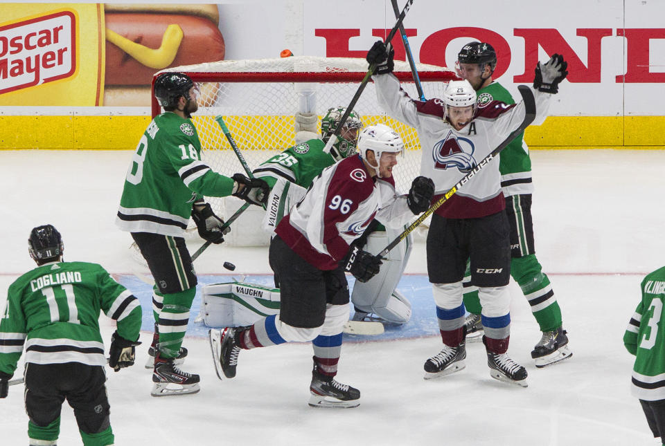 Colorado Avalanche right wing Mikko Rantanen (96) and center Nathan MacKinnon (29) celebrate a goal against the Dallas Stars during the second period of Game 3 of an NHL hockey second-round playoff series, Wednesday, Aug. 26, 2020, in Edmonton, Alberta. (Jason Franson/The Canadian Press via AP)