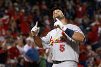 ARLINGTON, TX - OCTOBER 22: Albert Pujols #5 of the St. Louis Cardinals hits a solo home run in the ninth inning for his third home run of the night during Game Three of the MLB World Series against the Texas Rangers at Rangers Ballpark in Arlington on October 22, 2011 in Arlington, Texas. (Photo by Ronald Martinez/Getty Images)