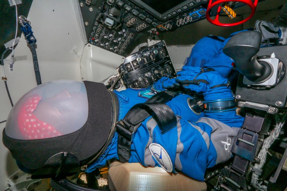 This Nov. 1, 2019 photo provided by Boeing shows Rosie the astronaut test dummy positioned in the space capsule at Kennedy Space Center.  The test dummy will be riding to the space station on Boeing’s new Starliner capsule next month, in the first test flight.  (Boeing via AP)