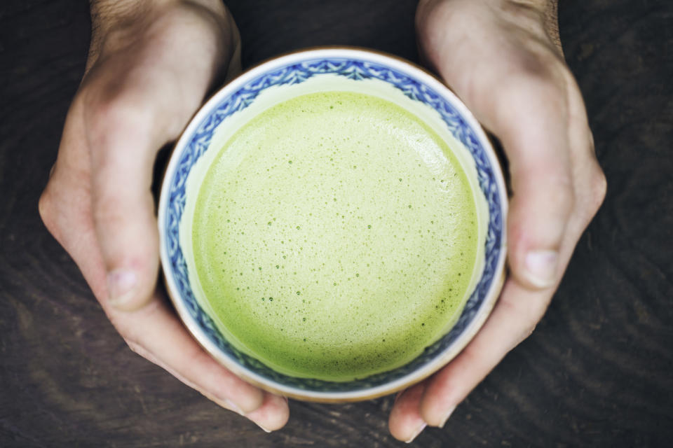 A cup of a hot matcha drink