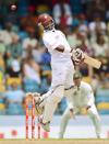 West Indies batsman Narsingh Deonarine avoids a bouncer off Australian bowler Ryan Harris during the second day of the first-of-three Test matches between Australia and West Indies at the Kensington Oval stadium in Bridgetown on April 8, 2012. AFP PHOTO/Jewel Samad (Photo credit should read JEWEL SAMAD/AFP/Getty Images)