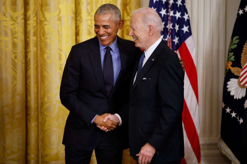 Former President Barack Obama and then-Vice President Joe Biden shake hands during an event to mark the 2010 passage of the Affordable Care Act in the East Room of the White House on April 05, 2022.