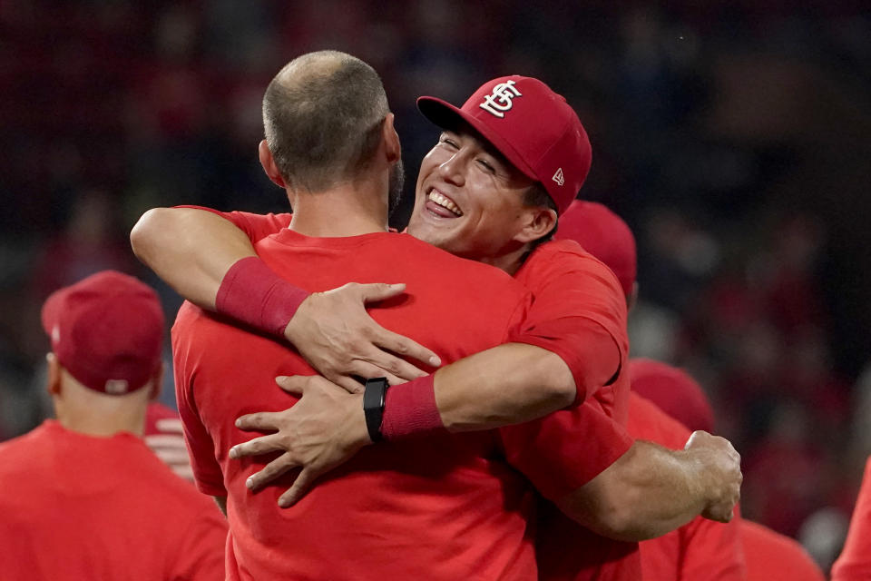 St. Louis Cardinals' Lars Nootbaar, right, hugs teammate Paul Goldschmidt as they celebrate after defeating the Milwaukee Brewers in a baseball game to clinch a playoff spot Tuesday, Sept. 28, 2021, in St. Louis. (AP Photo/Jeff Roberson)