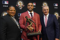 Robert D. Manfred, Jr., MLB Commissioner, right, Nelson Cruz, 2021 Roberto Clemente Award winner and Luis Roberto Clemente, Son of the late Hall of Famer Roberto Clemente pose before Game 2 of baseball's World Series between the Houston Astros and the Atlanta Braves Wednesday, Oct. 27, 2021, in Houston.(AP Photo/Sue Ogrocki)