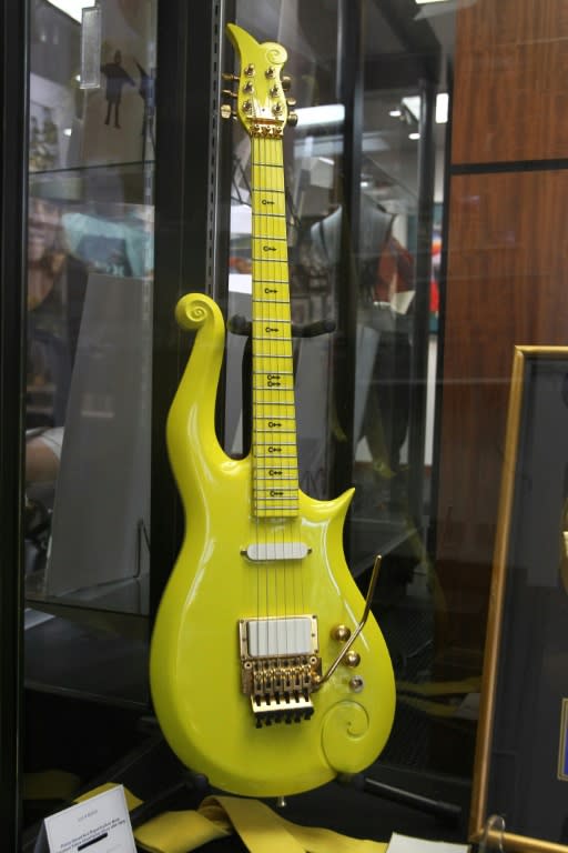 One of the items up for sale is a custom-made signature yellow "Cloud" guitar, like this one sold in 2016