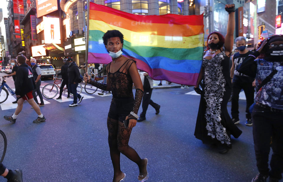 A protester holds a rainbow flag in support of transgender rights (SOPA Images / LightRocket via Getty file)