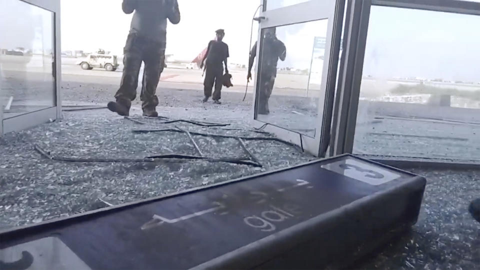 Glass and debris covers the damaged portion of the airport in Yemen’s southern city of Aden after an explosion, Wednesday, Dec. 30, 2020. The blast struck the airport building shortly after a plane carrying the newly formed Cabinet landed on Wednesday. No one on the government plane was hurt. (AP Photo)