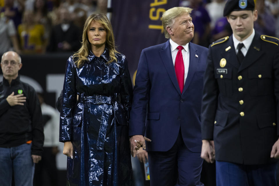 President Donald Trump and first lady Melania Trump arrive for the College Football Playoff National Championship game between LSU and Clemson, Monday, Jan. 13, 2020, in New Orleans. (AP Photo/ Evan Vucci)