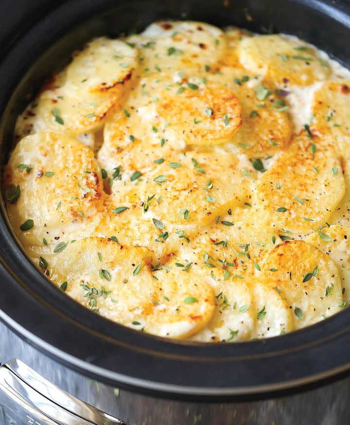 <strong>Get the&nbsp;</strong><a href="http://damndelicious.net/2016/11/17/slow-cooker-cheesy-scalloped-potatoes/"><strong>Slow Cooker Cheesy Scalloped Potatoes</strong></a><strong>&nbsp;recipe from Damn Delicious</strong>