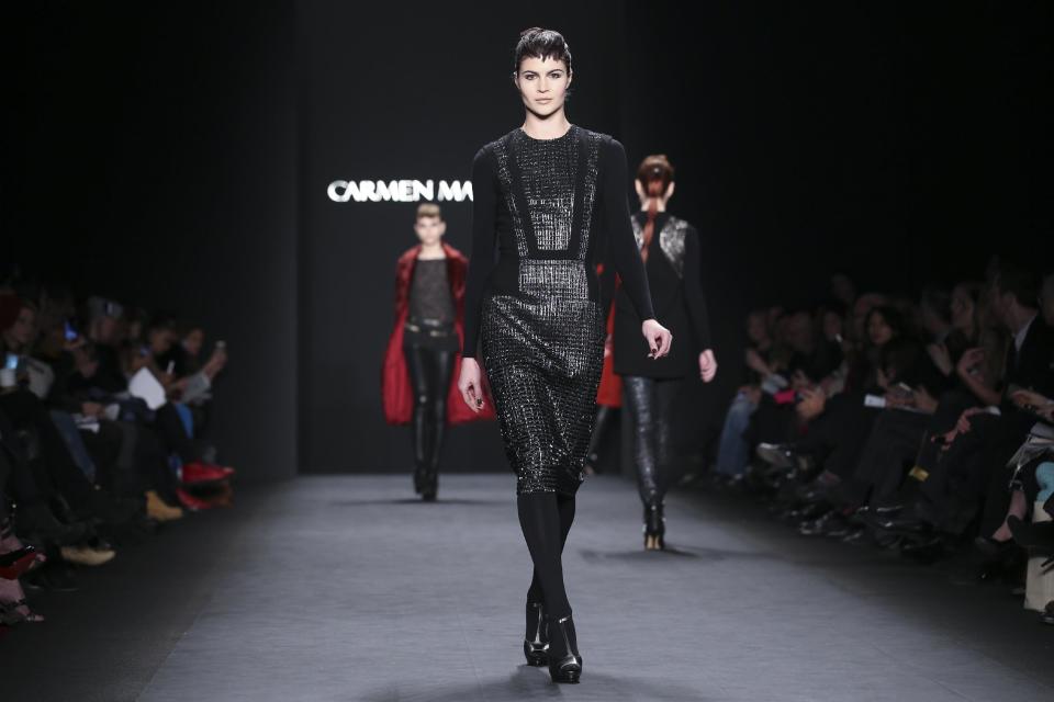 The Carmen Marc Valvo Fall 2014 collection is modeled during Fashion Week, Friday, Feb. 7, 2014, in New York. (AP Photo/John Minchillo)