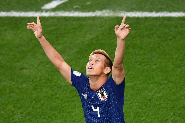 Keisuke Honda came off the bench to keep Japan's hopes of reaching the knockout stage in their own hands