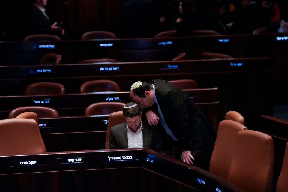 Parliament member Simcha Rothman, right, leans in to speak to Bezalel Smotrich, Israel's finance minister, in Jerusalem on March 27, 2023.