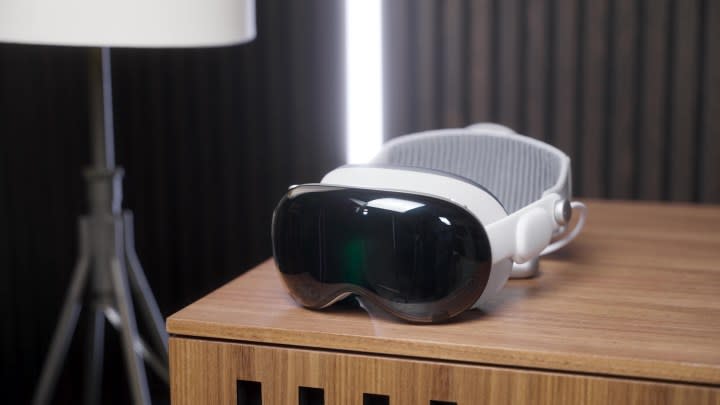 An Apple Vision Pro headset on a side table. 