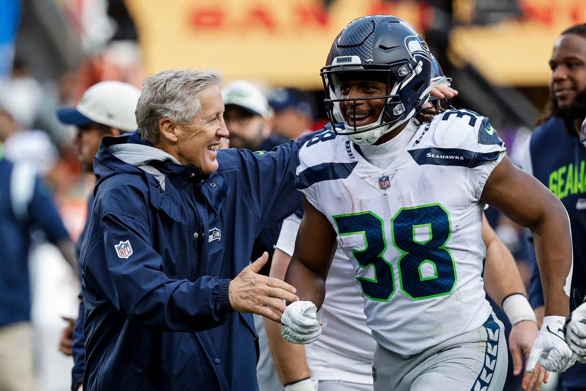 Seattle Seahawks head coach Pete Carroll, left, and Godwin Igwebuike (38) celebrate after place kicker Jason Myers kicked a 56-yard field goal during the first half of an NFL wild card playoff football game against the San Francisco 49ers in Santa Clara, Calif., Saturday, Jan. 14, 2023. (AP Photo/Josie Lepe)