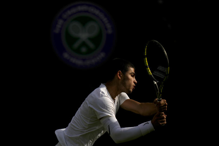 Spain's Carlos Alcaraz returns the ball to Germany's Oscar Otte in a men's singles match on day five of the Wimbledon tennis championships in London, Friday, July 1, 2022. (AP Photo/Alastair Grant)