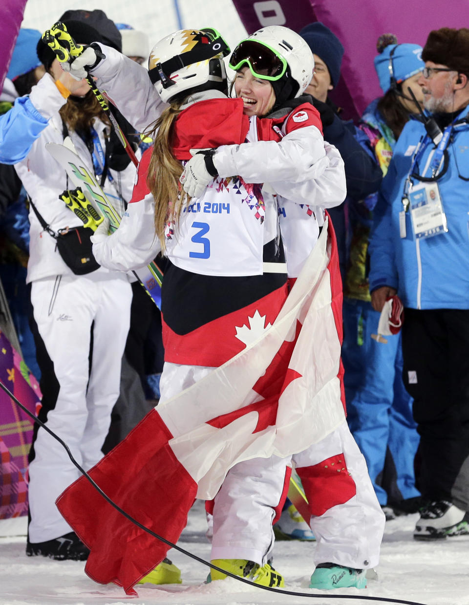 Canada's Justine Dufour-Lapointe, right, celebrates with her sister Chloe Dufour-Lapointe after Justine took the gold medal in the women's moguls final at the Rosa Khutor Extreme Park, at the 2014 Winter Olympics, Saturday, Feb. 8, 2014, in Krasnaya Polyana, Russia. Chloe Dufour-Lapointe took the silver medal. (AP Photo/Andy Wong)