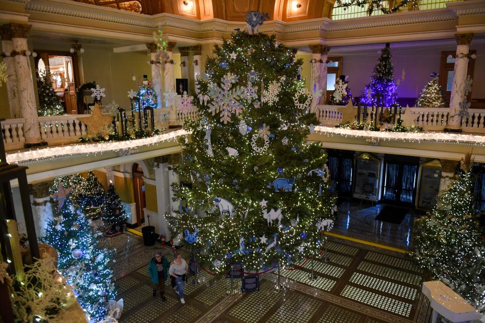 The South Dakota Capitol Christmas Tree stands in the rotunda on Tuesday, Dec. 5, 2023 in Pierre. The Great Plains Zoo and Butterfly House and Aquarium had the honor of decorating the 27-foot Black Hills spruce.