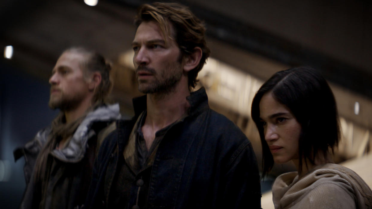  Charlie Hunnam, Michiel Huisman, and Sofia Boutella stand defiantly in a row in Rebel Moon. 