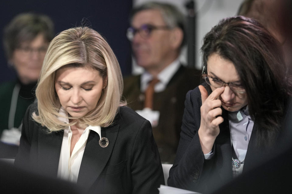 First Lady of Ukraine Olena Zelenska, left, and First Vice Prime Minister of Ukraine Yulia Svyrydenko, right, reacts at the World Economic Forum in Davos, Switzerland after a helicopter crash in Ukraine, where Minister of Internal Affairs Denys Monastyrsky died among others on Wednesday, Jan. 18, 2023. The annual meeting of the World Economic Forum is taking place in Davos from Jan. 16 until Jan. 20, 2023. (AP Photo/Markus Schreiber)