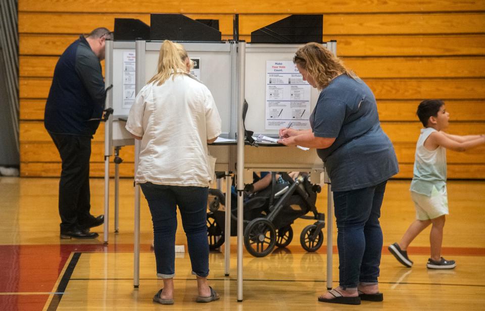 Voters fill out their ballots at the polling place at the Lincoln High gym Stockton on Tuesday.