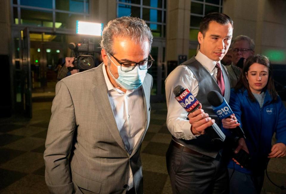 Sacramento City Councilman Sean Loloee is questioned by news reporters but had no comment as he leaves the Robert T. Matsui Federal Courthouse on Friday after being indicted by a federal grand jury on 25 charges, including conspiracy to defraud the U.S. Department of Labor, connected to his Viva Supermarket locations in the capital region.