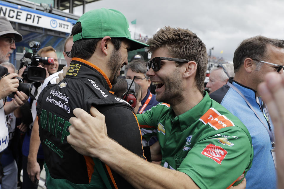 Kyle Kaiser celebrates with a crew member after qualifying for the Indianapolis 500 IndyCar auto race at Indianapolis Motor Speedway, Sunday, May 19, 2019 in Indianapolis. (AP Photo/Darron Cummings)