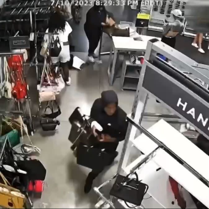 Security video captured a mob of thieves ransacking a Nordstrom Rack in Riverside and escaping with thousands of dollars worth of designer handbags. (Riverside Police Department)