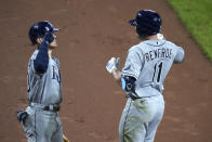 Tampa Bay Rays' Hunter Renfroe (11) is greeted near the dugout by Michael Brosseau after hitting a solo home run off Baltimore Orioles starting pitcher Bruce Zimmerman during the fourth inning of the second game of a baseball doubleheader, Thursday, Sept. 17, 2020, in Baltimore. (AP Photo/Julio Cortez)