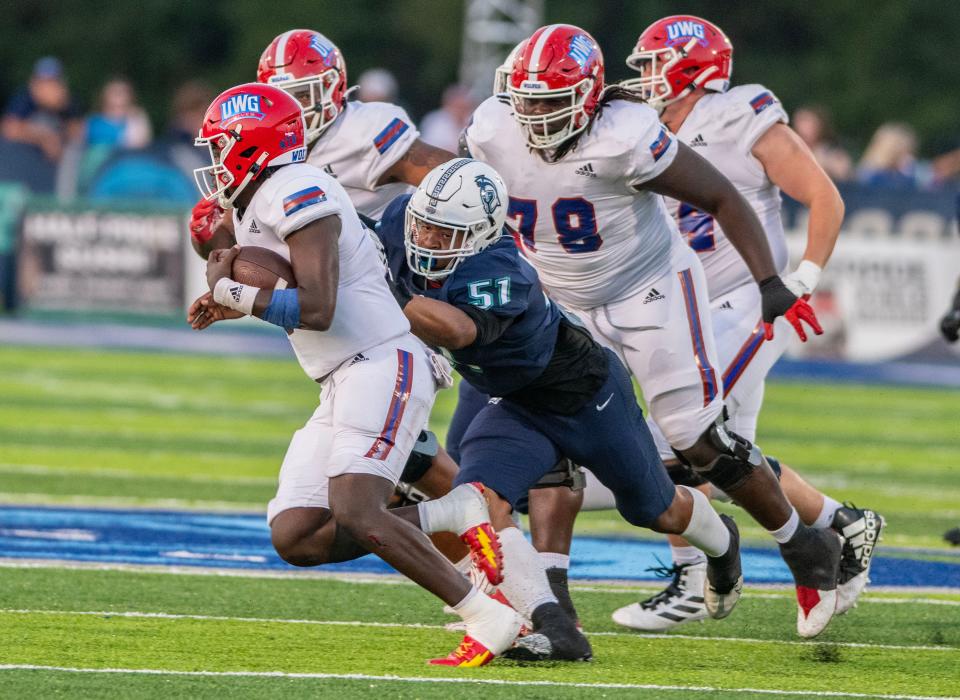 West Florida's Collin Shaw goes after West Georgia quarter back Cameran Brown during the Gulf South Conference opener against West Georgia at Pen Air Field at the University of West Florida Saturday, September 23, 2023.