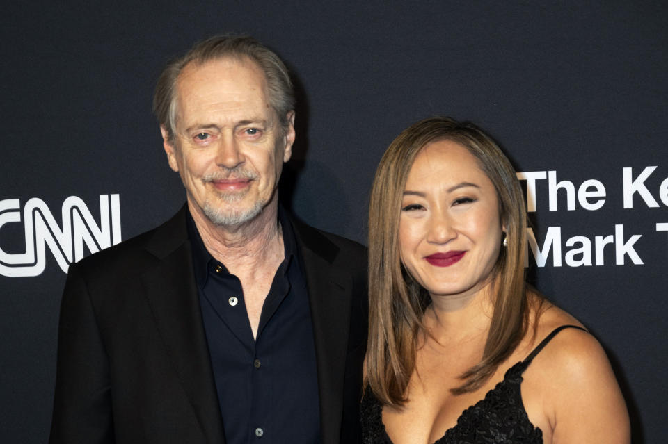 Steve Buscemi and his girlfriend, Karen Ho, arrive on the red carpet for the 24th Annual Mark Twain Prize for American Humor at the Kennedy Center for the Performing Arts, Sunday, March 19, 2023, in Washington. (AP Photo/Kevin Wolf)