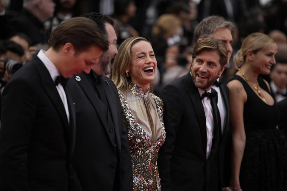 Jury president Ruben Ostlund, fourth from right, poses with jury members Paul Dano, Denis Menochet, Brie Larson, Damian Szifron and Julia Ducournau upon arrival at the opening ceremony and the premiere of the film 'Jeanne du Barry' at the 76th international film festival, Cannes, southern France, Tuesday, May 16, 2023. (AP Photo/Daniel Cole)