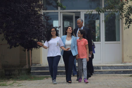 Basak Demirtas, wife of Selahattin Demirtas, jailed former leader and presidential candidate of Turkey's main pro-Kurdish Peoples' Democratic Party (HDP), leaves a regular visit to him in Edirne Prison near the northwest border with Greece and Bulgaria, as she is flanked by their daughters Delal and Dilda and Selahattin Demirtas's father Tahir Demirtas, Turkey, June 6, 2018. Picture taken June 6, 2018. REUTERS/Huseyin Aldemir