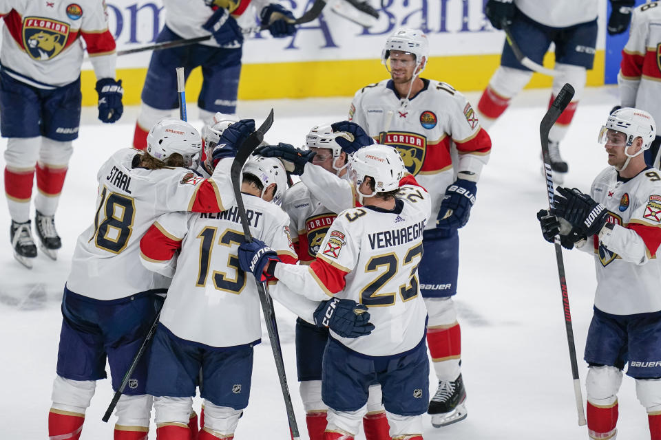 Florida Panthers center Sam Reinhart (13) celebrates with teammates after scoring the winning goal against the San Jose Sharks during the shootout of an NHL hockey game in San Jose, Calif., Thursday, Nov. 3, 2022. (AP Photo/Godofredo A. Vásquez)