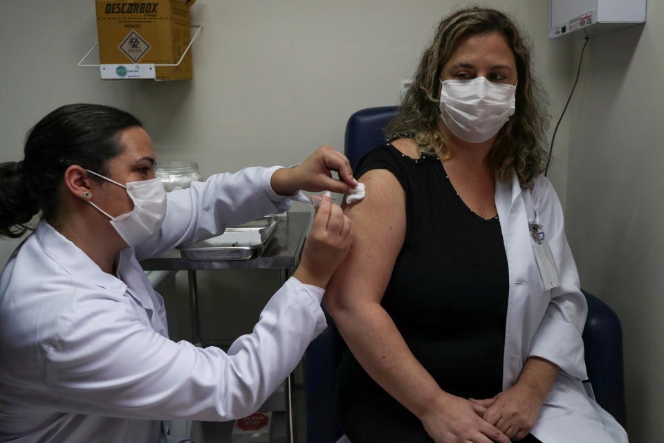 A nurse administers CoronaVac, a Sinovac's potential vaccine against the coronavirus disease (COVID-19), to a volunteer and nurse Sarah Rangon at Emilio Ribas Institute in Sao Paulo, Brazil July 30, 2020. Picture taken July 30, 2020. REUTERS/Amanda Perobelli