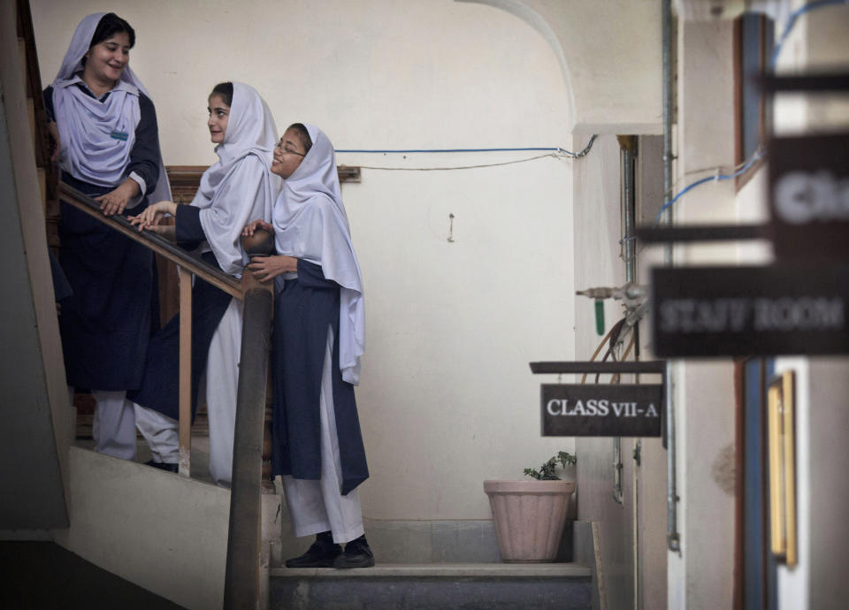 FILE - Pakistani children get ready for class at Malala Yousufzai's old school in Mingora, Swat Valley, Pakistan on Saturday, Oct 5, 2013. (AP Photo/Anja Niedringhaus, File)