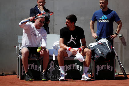 Tennis - French Open - Roland Garros - Paris - 25/05/2017. Novak Djokovic of Serbia and his coach Andre Agassi during a training session. REUTERS/Benoit Tessier