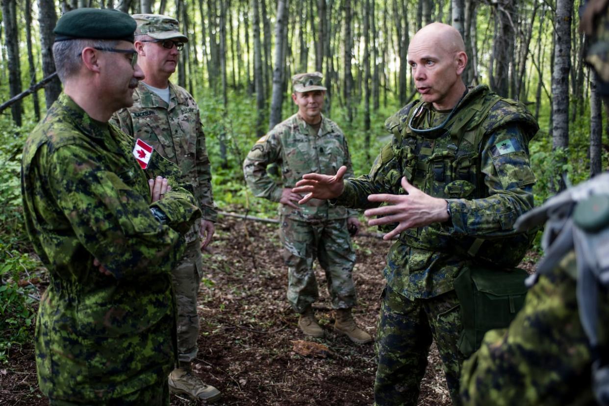 Gen. Wayne Eyre, who was a brigadier general when this photo was taken, speaks with Lt.-Gen. Paul Wynnyk, commander of the Canadian Army, in the Wainwright Garrison training area during Exercise MAPLE RESOLVE on June 2, 2016. (Master Cpl. Malcolm Byers/DND Combat Camera - image credit)