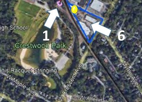 Proposed location of cell tower (yellow dot) 172 feet from existing cell tower (pink dot) in Allendale.