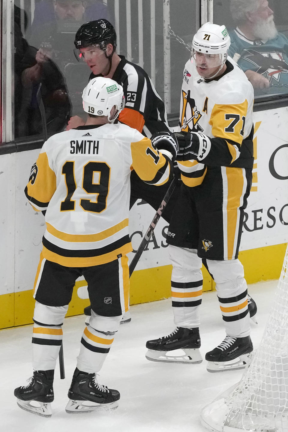 Pittsburgh Penguins center Evgeni Malkin, right, is congratulated by right wing Reilly Smith (19) after scoring during the third period of an NHL hockey game against the San Jose Sharks in San Jose, Calif., Saturday, Nov. 4, 2023. (AP Photo/Jeff Chiu)