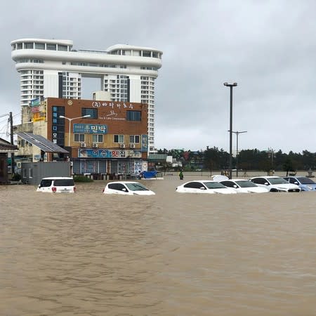 Cars are submerged in floodwater after Typhoon Mitag brought heavy rain and flood to Gangneung, South Korea