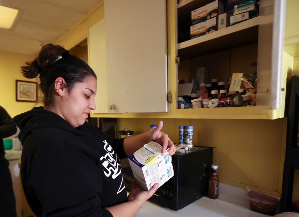 Rosa Mandujano shows a cupboard full of medicine related to her two children’s asthma at their home near the Salton Sea and Mecca, California, on Thursday, Dec. 14, 2023. | Kristin Murphy, Deseret News