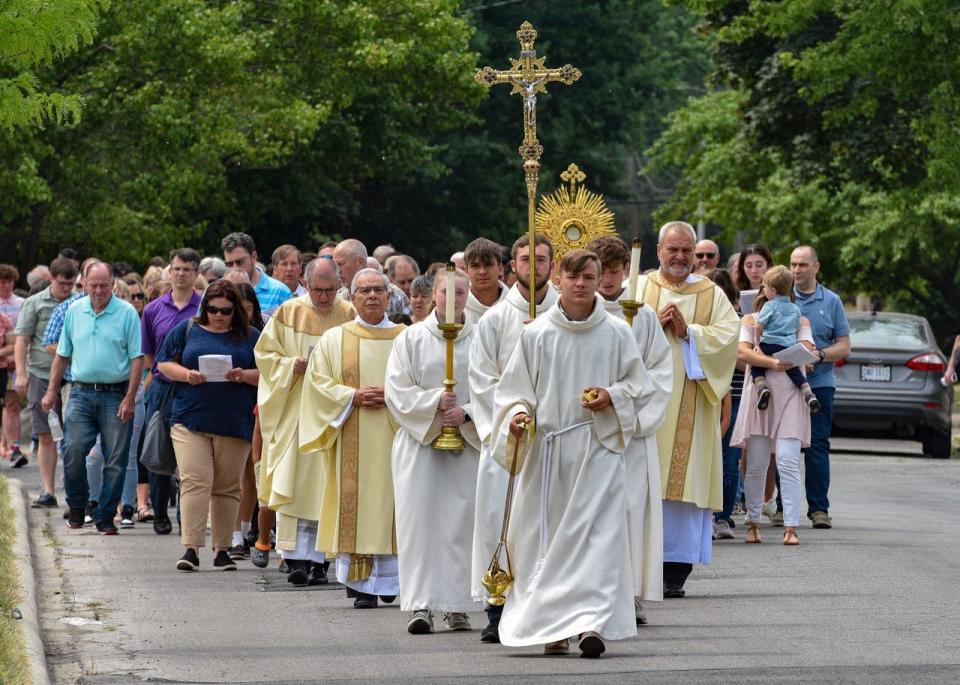 Local Catholics celebrated the Feast of Corpus Christi on Sunday with a procession from St. Joseph Catholic Church to St. Ann. The procession honored the Catholic belief in the transubstantiation of the bread and wine in the eucharist.