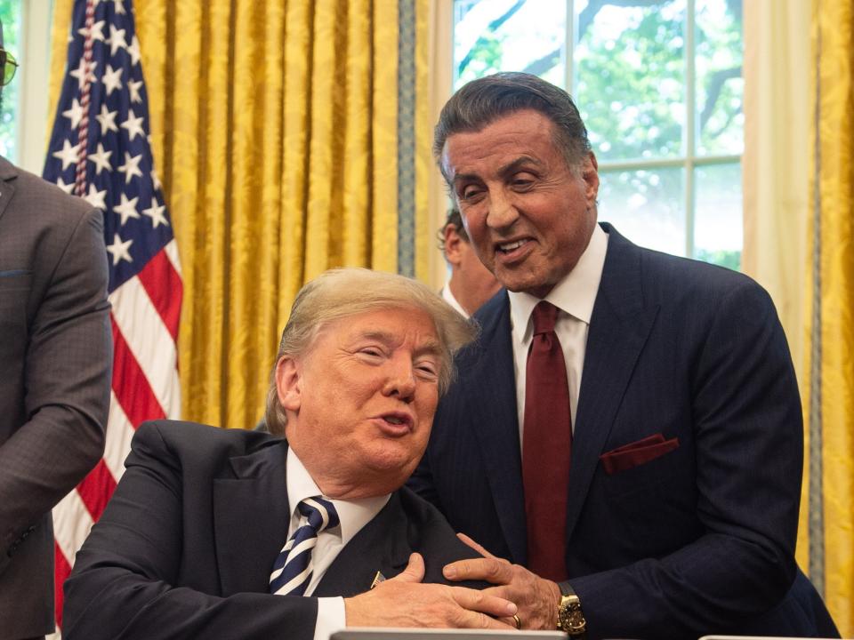 Sylvester Stallone pictured with Donald Trump during a visit to the White House in 2018 (AFP via Getty Images)