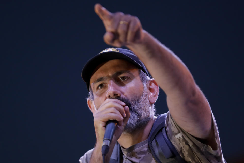 FILE - In this file photo taken on Thursday, April 26, 2018, Nikol Pashinian gestures as he speaks to demonstrators gathered at Republic Square in Yerevan, Armenia. Armenians are set to cast ballots in parliamentary elections expected to cement the incumbent prime minister's grip on power. (AP Photo/Sergei Grits, File)